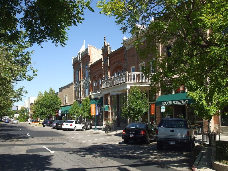 Historic brick storefronts and trees along downtown Center Street in Provo, Utah